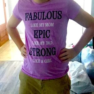 A purple shirt that has a quote about dad and mom